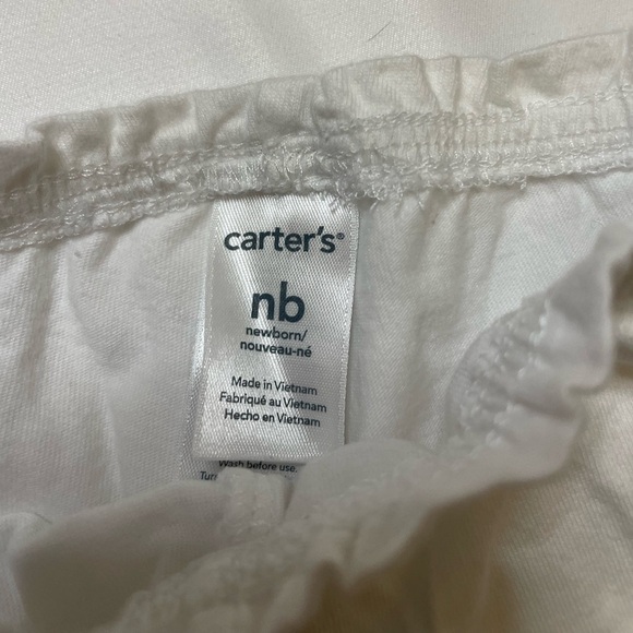 Girls Carter’s size newborn 3 pants, 2 sleep sacks, 1 shirt, and 1 onsie set. - Picture 10 of 11